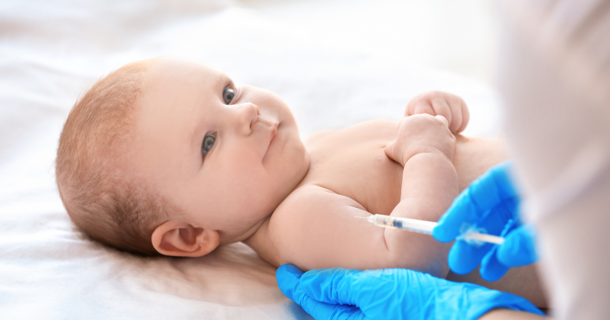 Newborn at pediatric vaccination appointment showing gentle approaches to managing baby vaccination side effects
