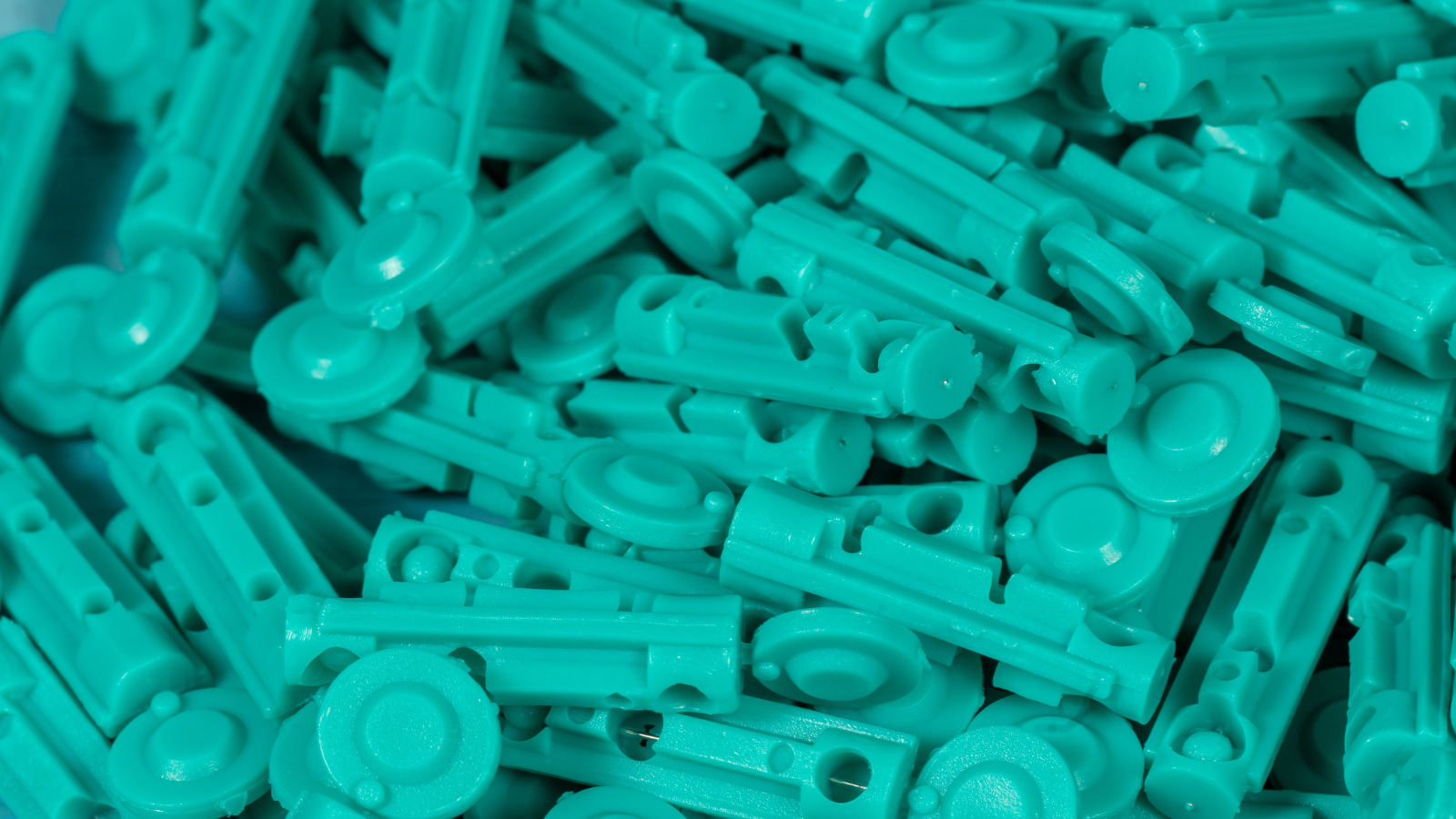 Close-up of teal sterile diabetes lancets for fingertip blood glucose testing