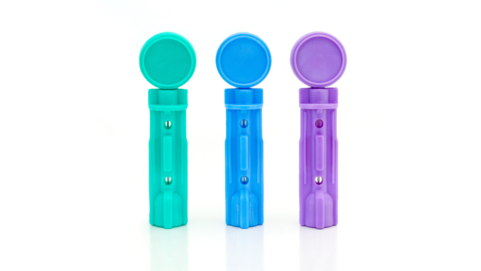 Three sterile lancets with round protective caps in teal, blue, and purple on a white background