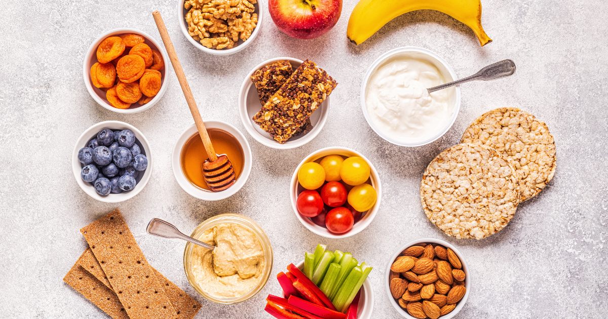 Healthy diabetic snacks including yogurt, berries, and whole grains arranged on a tray to support stable blood sugar.