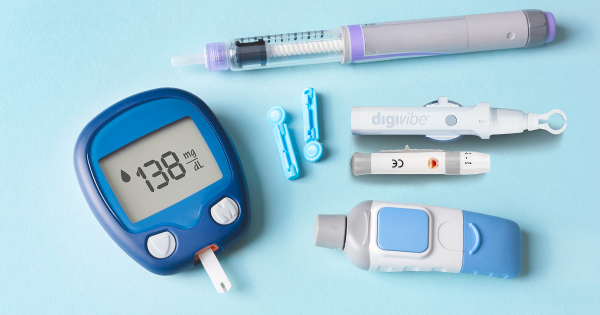 Blue glucose meter showing 103, insulin pen, lancet device, and single test strip arranged on a pastel surface.