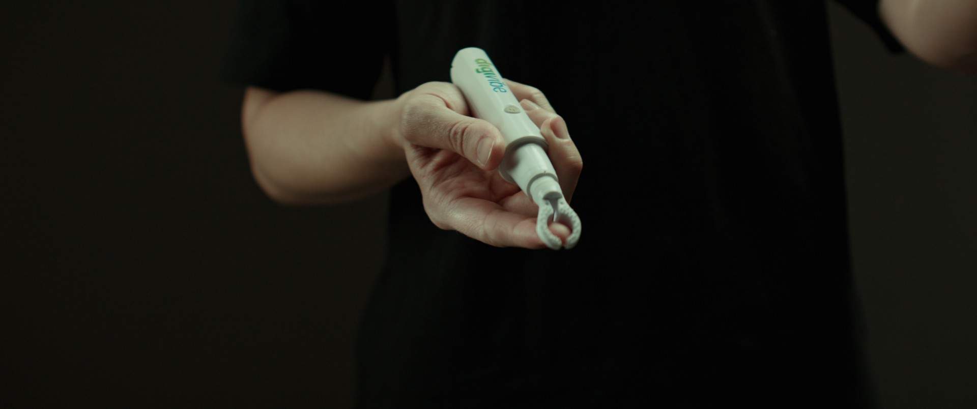 Close-up of Digivibe handheld device in use